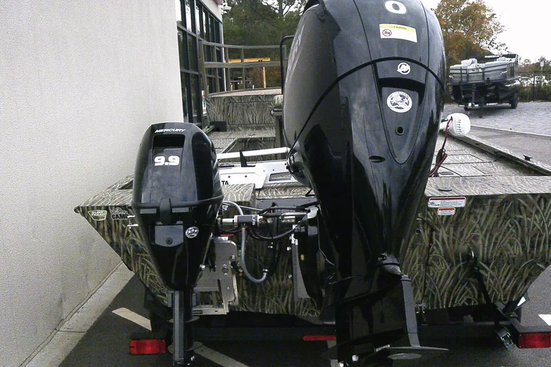 Slide: The Image of 2026 Tracker Grizzly 2072 CC Sportsman Kicker boat with dual Mercury outboard motors. - 3