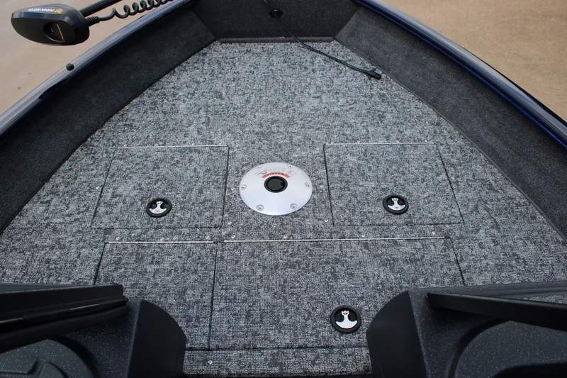 Slide: The Image of 2026 Tracker Pro Guide V-16 WT boat deck with storage compartments and trolling motor. - 7