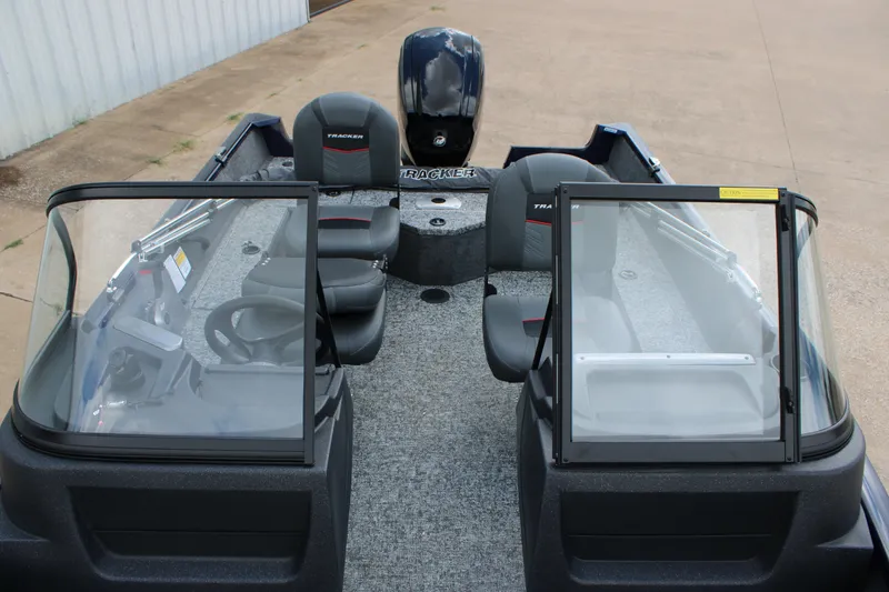 Slide: The Image of 2026 Tracker Pro Guide V-16 WT boat interior with dual consoles and seating. - 6