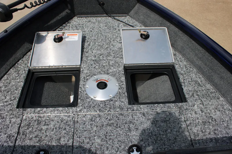 Slide: The Image of 2026 Tracker Pro Guide V-16 WT boat storage compartments with open lids. - 9