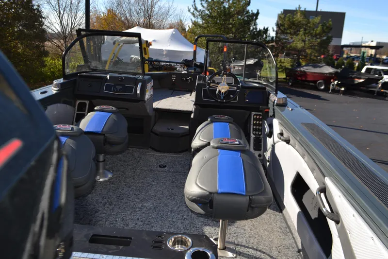 Slide: The Image of 2026 Ranger VX1988 WT boat interior with blue and gray seating, steering console, and equipment. - 4