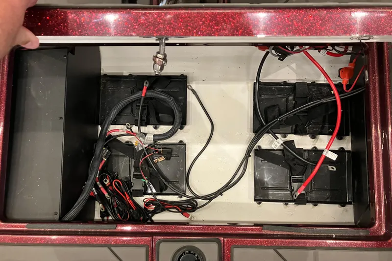 Slide: The Image of Battery compartment of a 2026 Nitro ZV20 boat, featuring organized wiring and connections. - 9