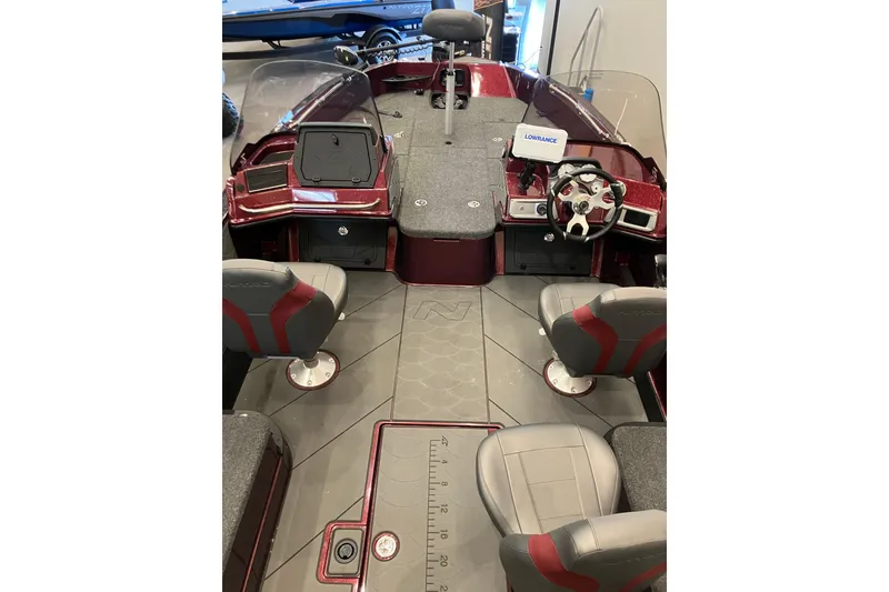 Slide: The Image of Interior view of a 2026 Nitro ZV20 boat with modern seating and dashboard. - 2