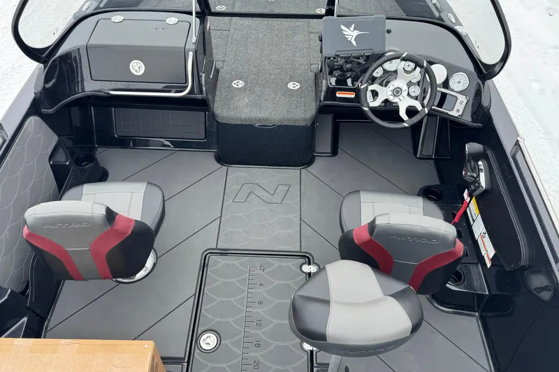 Slide: The Image of 2026 Nitro ZV19 Sport boat interior with steering wheel, seats, and dashboard. - 5