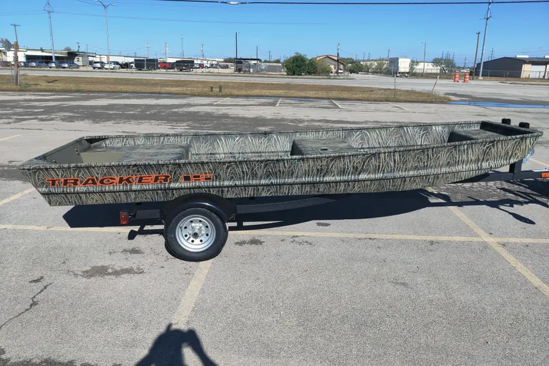 The Image of 2026 Tracker Grizzly 15 Jon boat on trailer in parking lot. - 0