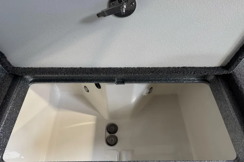 Slide: The Image of Open storage compartment in 2026 Ranger 212LS boat, featuring a sleek interior design. - 12