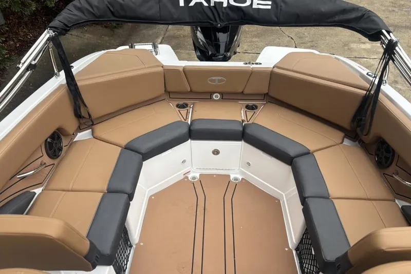 Slide: The Image of 2026 Tahoe 210 S boat interior with tan and black seating, spacious layout. - 116