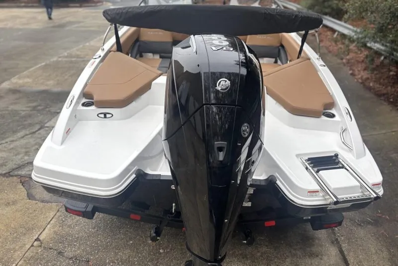 Slide: The Image of 2026 Tahoe 210 S boat with powerful outboard motor and sleek design. - 119