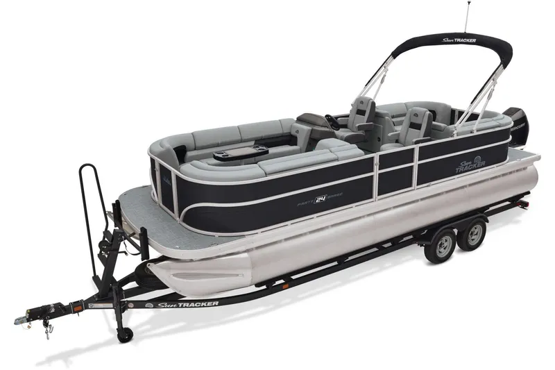 Slide: The Image of 2026 Sun Tracker Party Barge 24 XP3 interior with plush seating at Brownie's Marine showroom. - 9