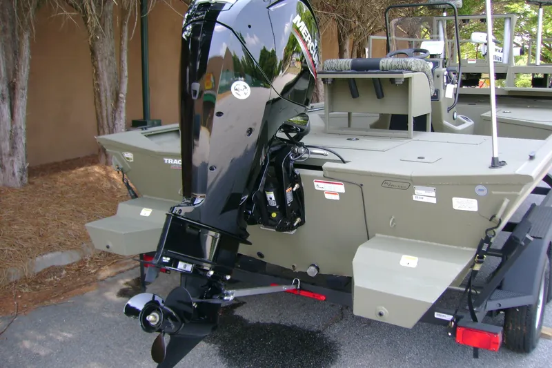 Slide: The Image of 2026 Tracker Grizzly 2072 CC Sportsman boat with powerful Mercury outboard motor. - 4