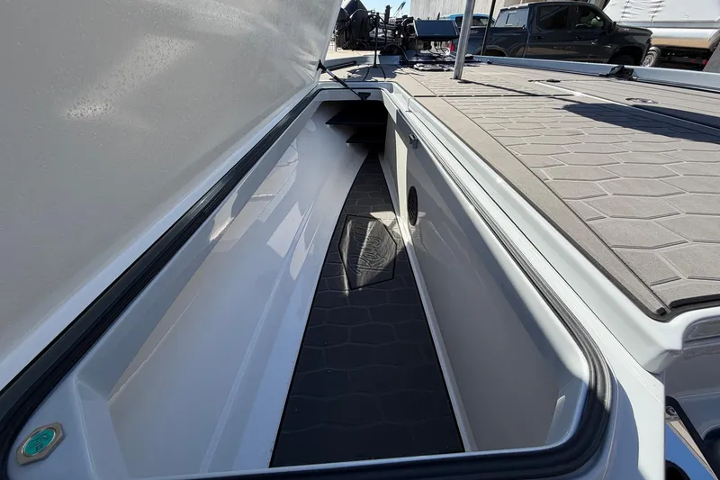 Slide: The Image of 2026 Ranger Z521R Cup-Equipped boat storage compartment with sleek design and ample space. - 23