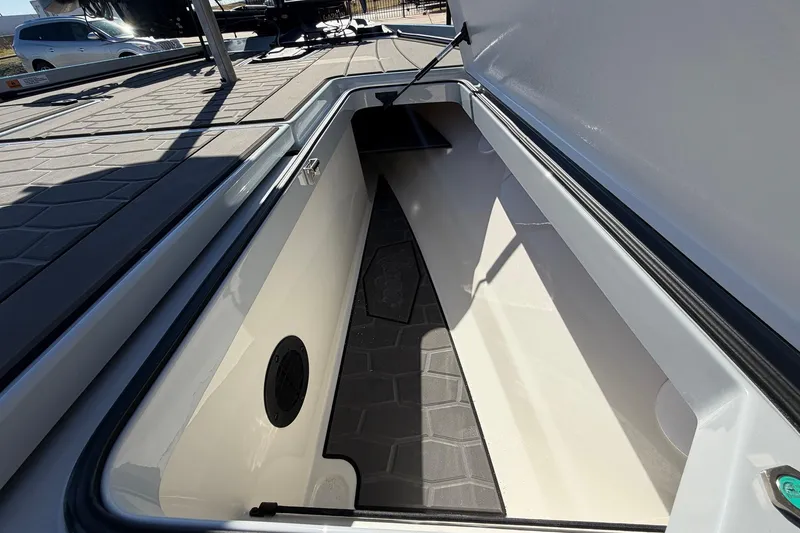 Slide: The Image of Open storage compartment in 2026 Ranger Z521R Cup-Equipped boat, showcasing interior space. - 29