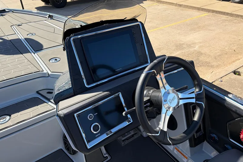Slide: The Image of 2026 Ranger Z521R Cup-Equipped boat dashboard with steering wheel and digital display. - 45