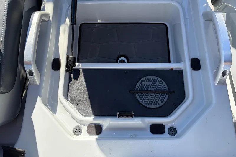 Slide: The Image of 2026 Ranger Z521R Cup-Equipped boat storage compartment with handles and drainage system. - 59
