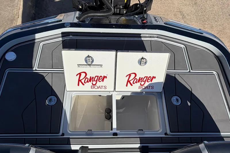 Slide: The Image of 2026 Ranger Z521R Cup-Equipped boat deck with storage compartments and logo. - 64