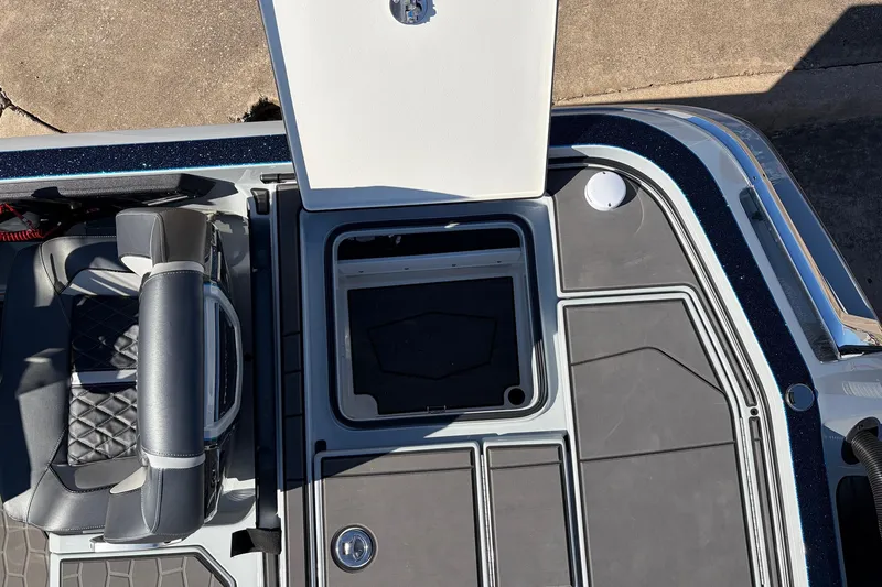 Slide: The Image of 2026 Ranger Z521R Cup-Equipped boat interior with open storage compartment and seating. - 69