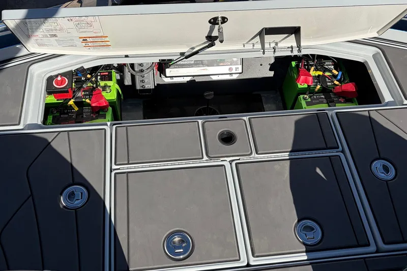Slide: The Image of 2026 Ranger Z521R Cup-Equipped boat battery compartment with green batteries and wiring. - 70