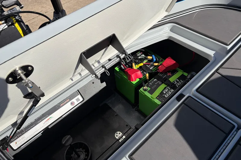 Slide: The Image of 2026 Ranger Z521R Cup-Equipped boat battery compartment with green lithium batteries. - 71