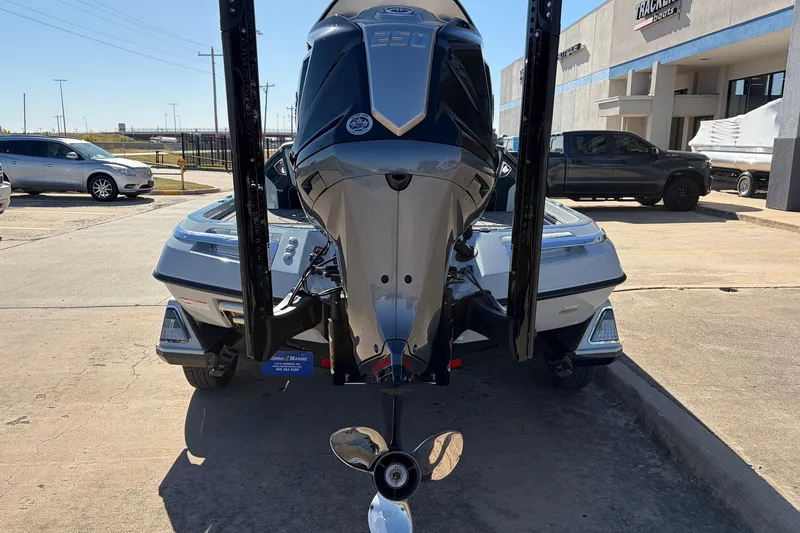 Slide: The Image of 2026 Ranger Z521R Cup-Equipped boat with powerful outboard motor, parked outdoors. - 9