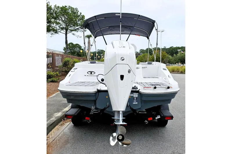 Slide: The Image of 2026 Tahoe 2150 CC boat on trailer with canopy in parking lot. - 4