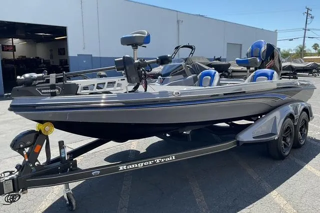 Slide: The Image of 2026 Ranger Z518 boat on trailer, parked outside a building. - 8