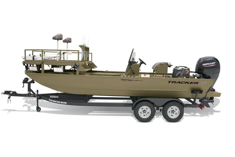 Slide: The Image of 2026 Tracker Grizzly 2072 CC Sportsman boat interior with steering console and seating. - 2