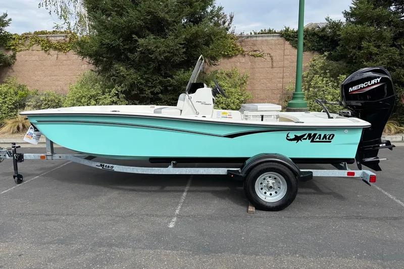 The Image of 2026 Mako Pro Skiff 15 CC boat on trailer, parked outdoors. - 0