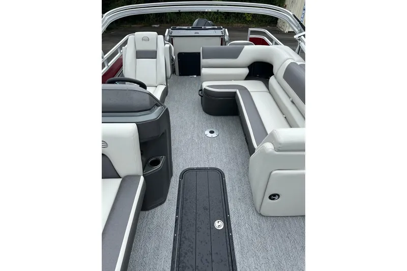 Slide: The Image of 2026 Sun Tracker Fishin' Barge 22 XP3 interior with gray seating and spacious layout. - 4