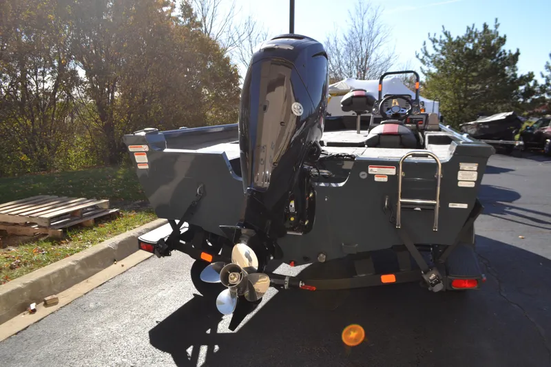 Slide: The Image of 2026 Ranger VS1682SC Reata boat with outboard motor, parked outdoors. - 1