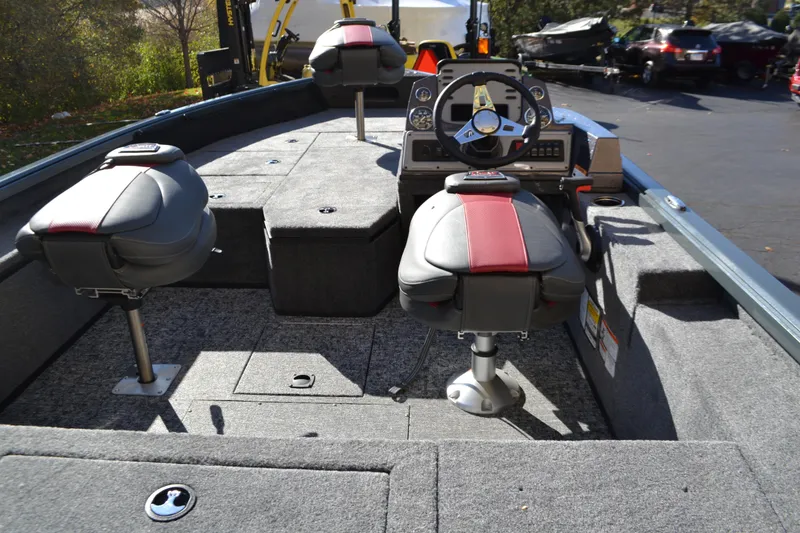 Slide: The Image of 2026 Ranger VS1682SC Reata boat interior with seating and steering console. - 2