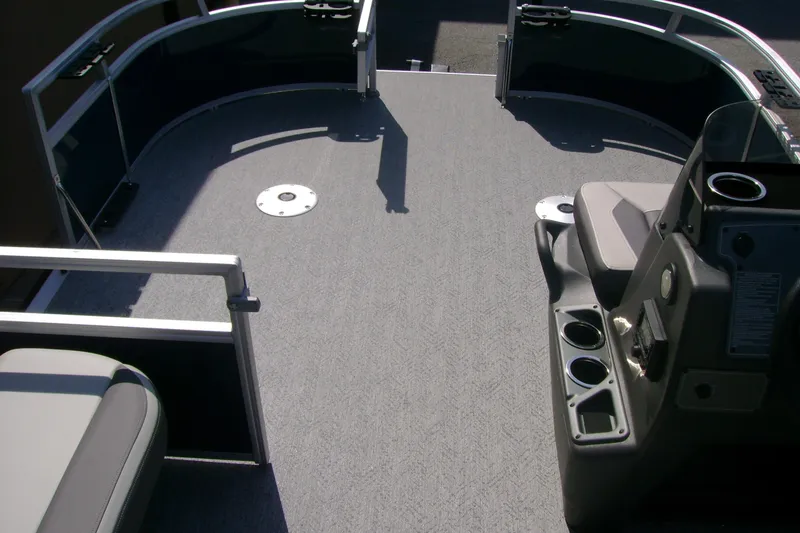 Slide: The Image of 2026 Sun Tracker Bass Buggy 16 XL Select pontoon boat interior with seating and console. - 6