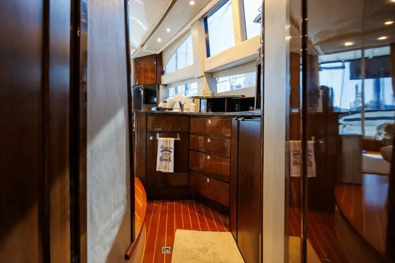Slide: The Image of Interior of 2010 Meridian 391 Sedan yacht with modern kitchen and wood finish. - 14