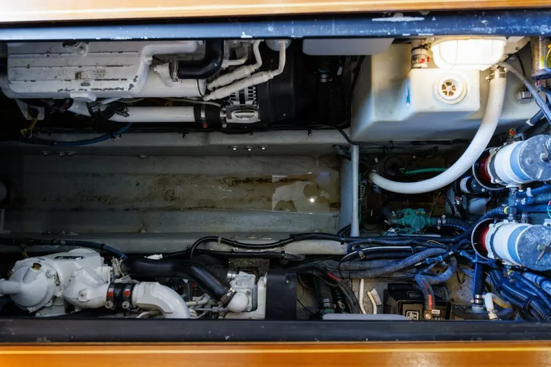 Slide: The Image of Engine compartment of a 2010 Meridian 391 Sedan boat, showcasing mechanical components. - 33