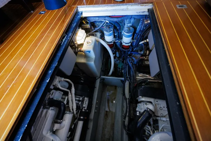 Slide: The Image of Engine compartment of a 2010 Meridian 391 Sedan yacht with visible components and wiring. - 36