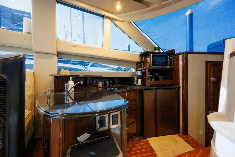 Slide: The Image of Interior of 2010 Meridian 391 Sedan yacht with modern kitchen amenities. - 6