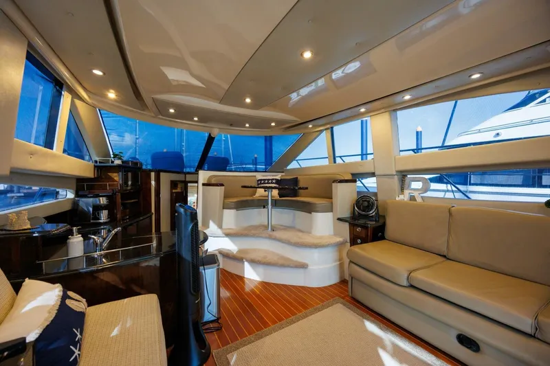 Slide: The Image of Luxurious interior of 2010 Meridian 391 Sedan yacht with modern furnishings and panoramic windows. - 8