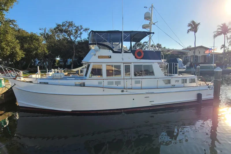 The Image of 2000 Grand Banks 46 Classic yacht docked in sunny marina setting. - 0