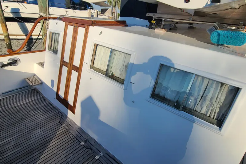 Slide: The Image of Grand Banks 46 Classic yacht deck with wooden accents, 2000 model. - 10