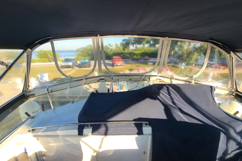 Slide: The Image of Interior view of 2000 Grand Banks 46 Classic yacht with covered seating area. - 13
