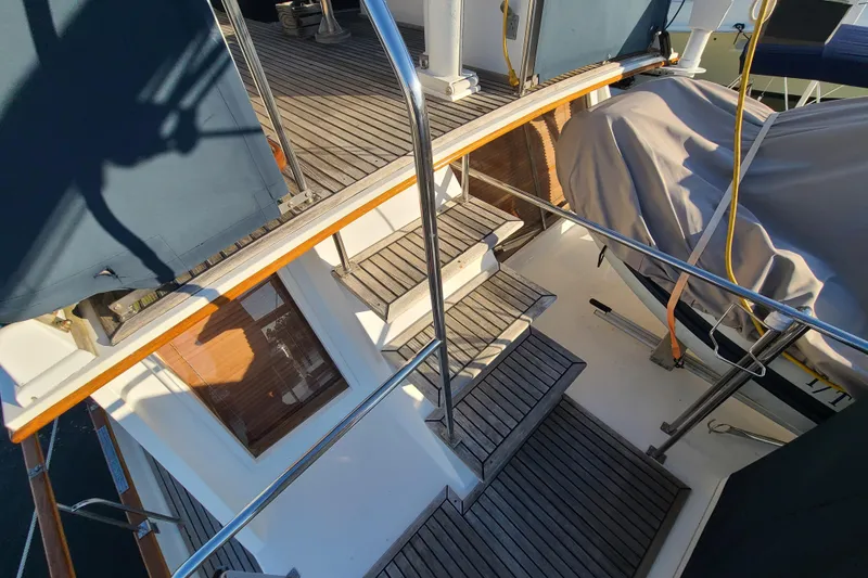 Slide: The Image of Staircase on 2000 Grand Banks 46 Classic yacht with wooden deck and railing. - 24