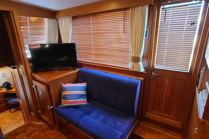 Slide: The Image of Interior of 2000 Grand Banks 46 Classic yacht with cozy seating and TV. - 28