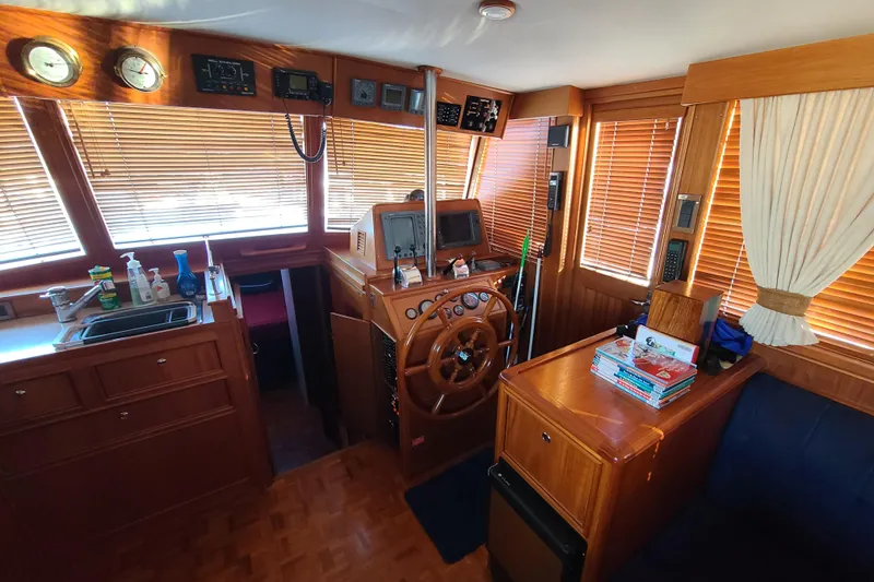 Slide: The Image of Interior of 2000 Grand Banks 46 Classic yacht with wooden helm and navigation equipment. - 30