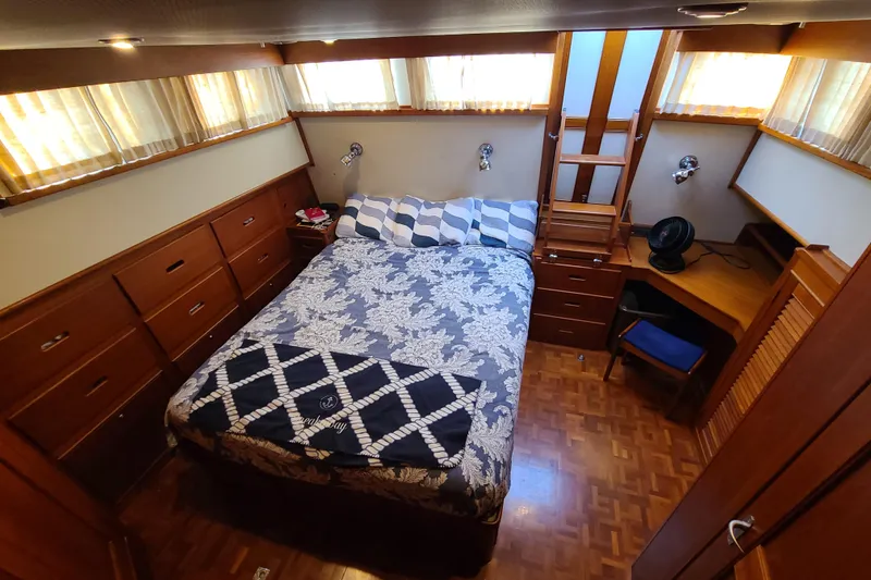 Slide: The Image of Luxurious cabin interior of 2000 Grand Banks 46 Classic yacht with wood furnishings. - 38