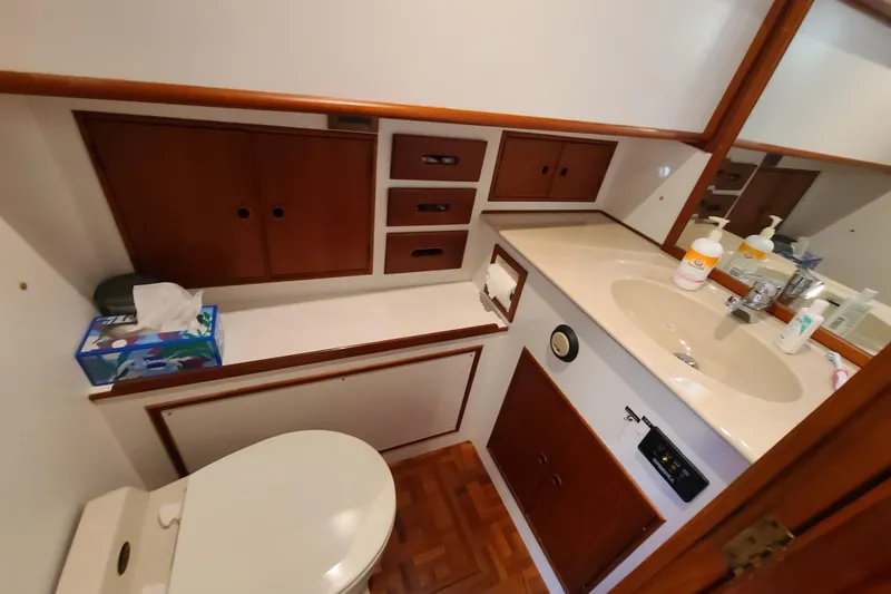 Slide: The Image of Bathroom interior of 2000 Grand Banks 46 Classic yacht, featuring wooden cabinetry and sink. - 41