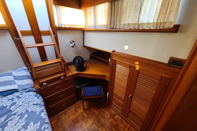 Slide: The Image of Cozy cabin interior of 2000 Grand Banks 46 Classic yacht with wooden furnishings. - 43