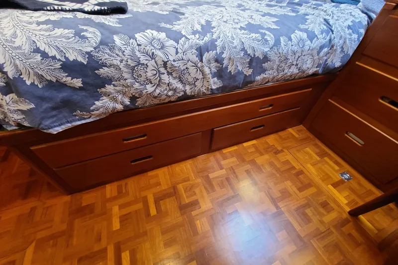 Slide: The Image of Wooden storage drawers under bed with floral bedding on Grand Banks 46 Classic, 2000 model. - 45