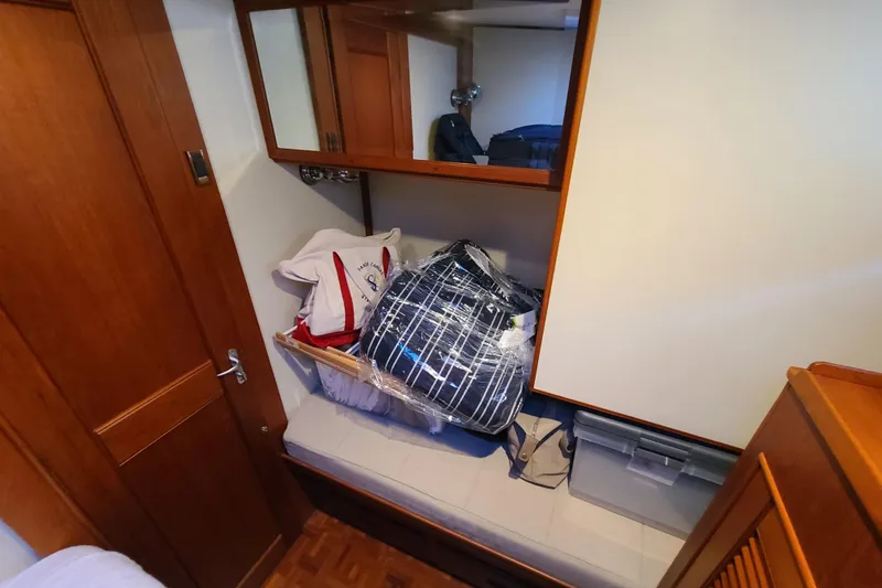 Slide: The Image of Interior cabin of 2000 Grand Banks 46 Classic with storage and bags. - 51