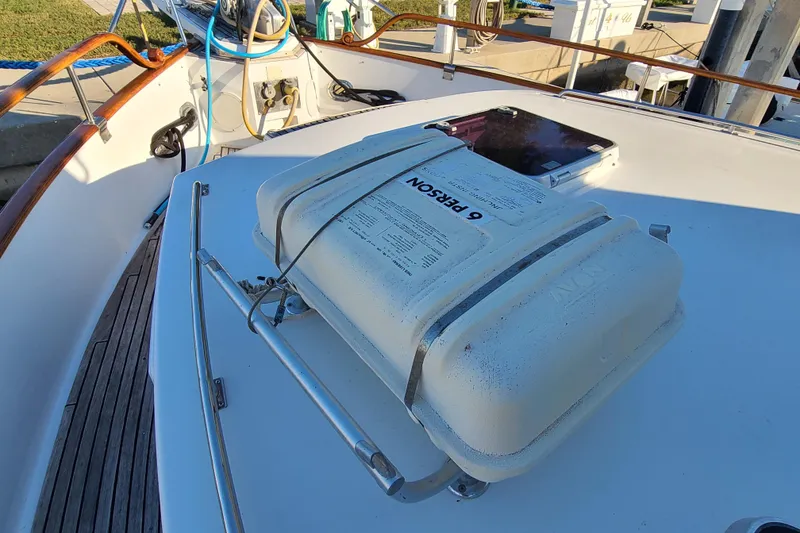 Slide: The Image of Deck of 2000 Grand Banks 46 Classic with life raft and hatch. - 7