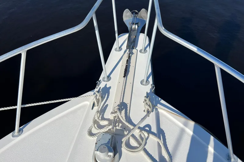 Slide: The Image of Bow of 2004 Henriques 35 Express boat with anchor and ropes. - 101