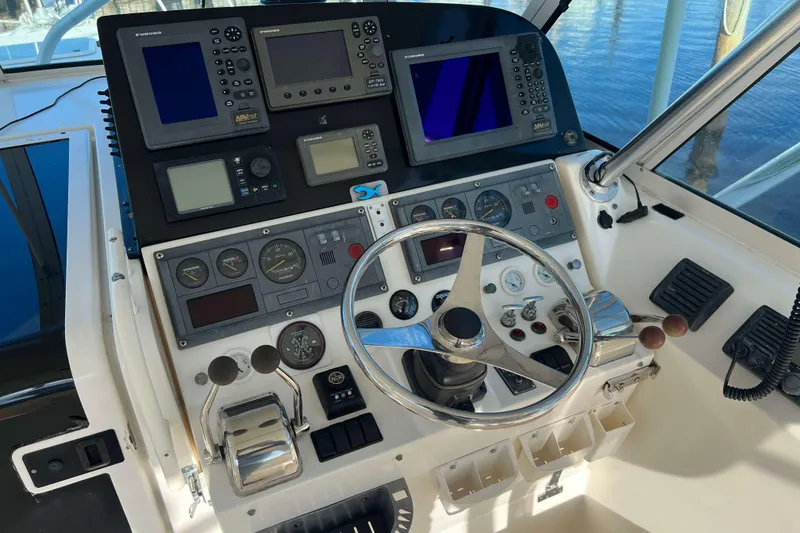 Slide: The Image of Helm of 2004 Henriques 35 Express boat with navigation instruments and steering wheel. - 31